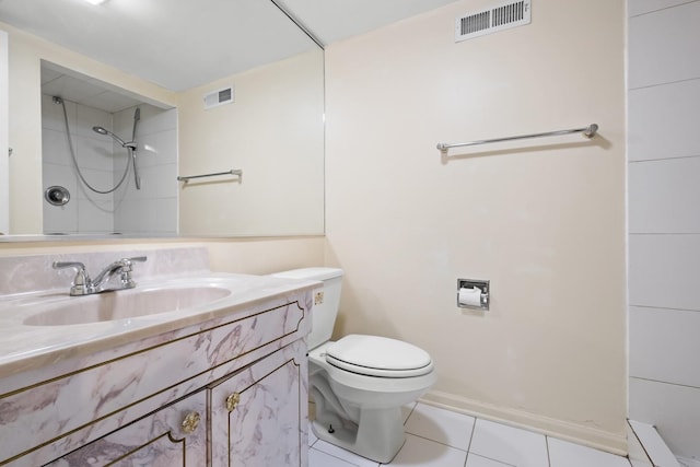 535 Glenshire Rd, Glenview, IL 60025 - bathroom featuring tile patterned floors, vanity, a shower, and baseboard heating