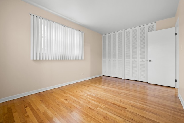 535 Glenshire Rd, Glenview, IL 60025 - unfurnished bedroom with wood finished floors and baseboards