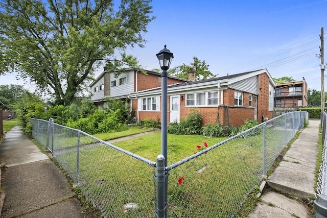 535 Glenshire Rd, Glenview, IL 60025 - view of front of house featuring brick siding and a fenced backyard