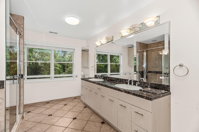 806 Lawler Ave, Wilmette, IL 60091 - bathroom with double vanity, a stall shower, and tile patterned flooring