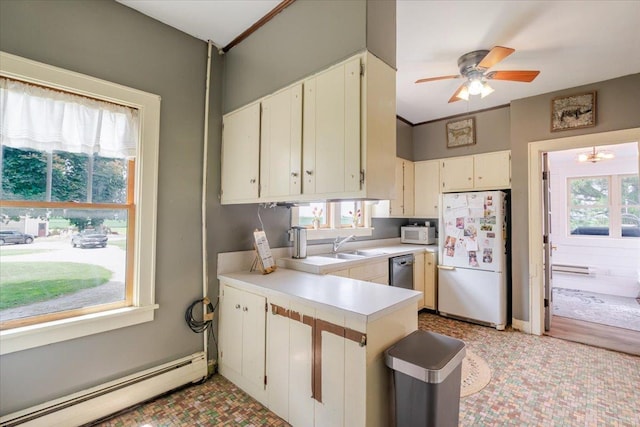 879 2300th Ave, Chestnut, IL 62518 - kitchen featuring white appliances, a baseboard heating unit, light countertops, ceiling fan, and a peninsula