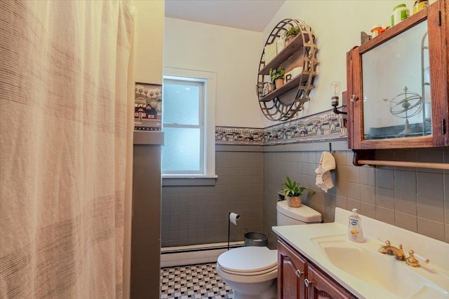 879 2300th Ave, Chestnut, IL 62518 - bathroom featuring baseboard heating, tile walls, vanity, a wainscoted wall, and curtained shower