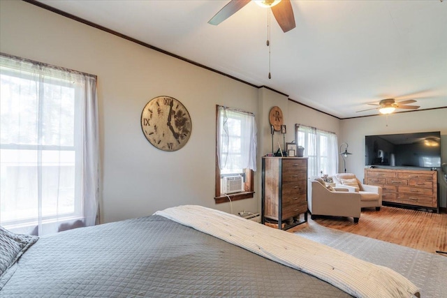 879 2300th Ave, Chestnut, IL 62518 - bedroom with ornamental molding, wood finished floors, cooling unit, and ceiling fan