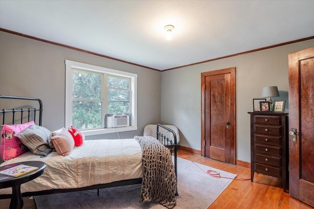879 2300th Ave, Chestnut, IL 62518 - bedroom featuring ornamental molding, cooling unit, and light wood-style flooring
