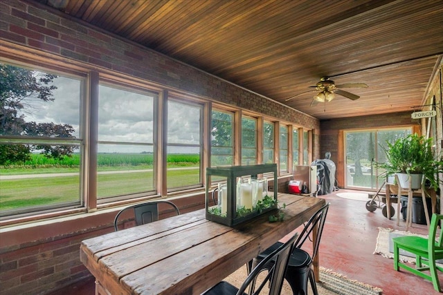 879 2300th Ave, Chestnut, IL 62518 - sunroom / solarium featuring ceiling fan, brick wall, outdoor dining space, and wood ceiling