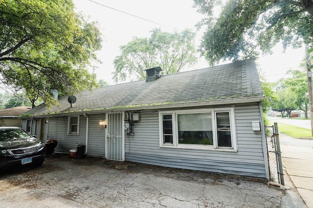 12400-02 S Green St, Calumet Park, IL 60827 - view of front of home with a chimney and roof with shingles