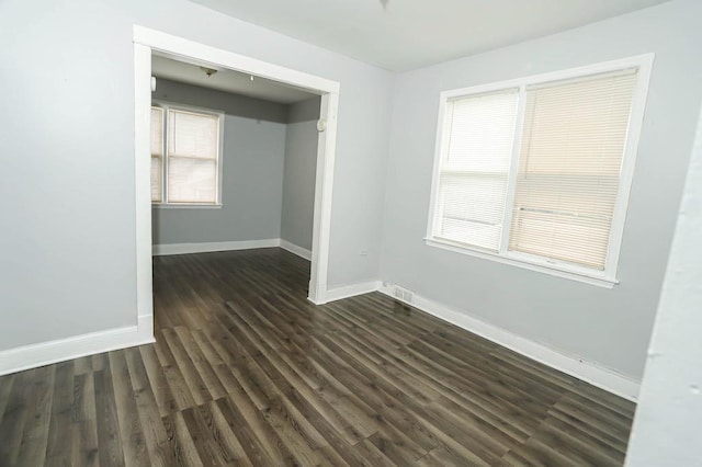 12400-02 S Green St, Calumet Park, IL 60827 - unfurnished bedroom with baseboards and dark wood-type flooring