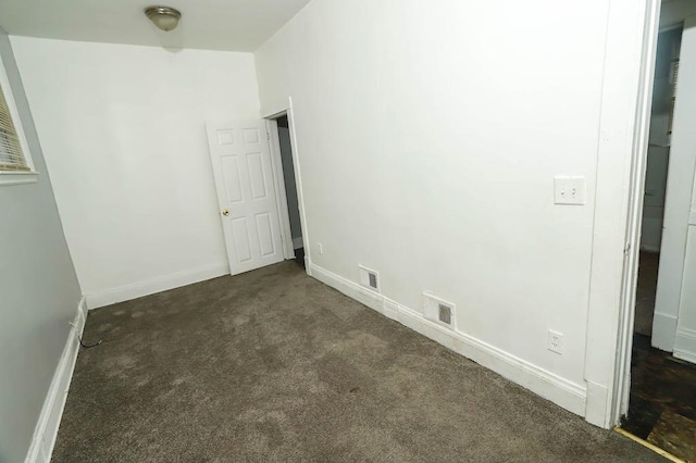 12400-02 S Green St, Calumet Park, IL 60827 - unfurnished bedroom with dark colored carpet and baseboards