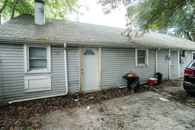 12400-02 S Green St, Calumet Park, IL 60827 - rear view of house featuring a chimney and roof with shingles