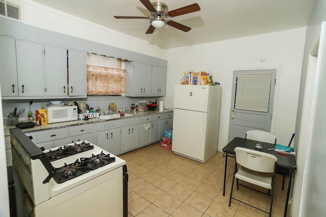 12400-02 S Green St, Calumet Park, IL 60827 - kitchen with white appliances, ceiling fan, light tile patterned floors, and light countertops