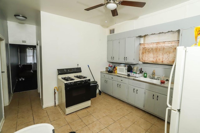 12400-02 S Green St, Calumet Park, IL 60827 - kitchen with white appliances, light tile patterned floors, ceiling fan, and light countertops