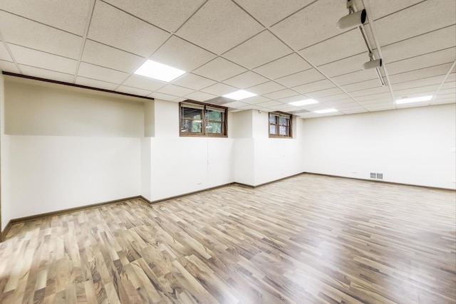 705 Wood Creek Dr, Antioch, IL 60002 - below grade area featuring wood finished floors and a drop ceiling