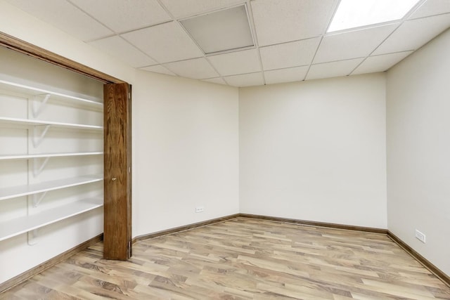 705 Wood Creek Dr, Antioch, IL 60002 - below grade area with a drop ceiling and wood finished floors