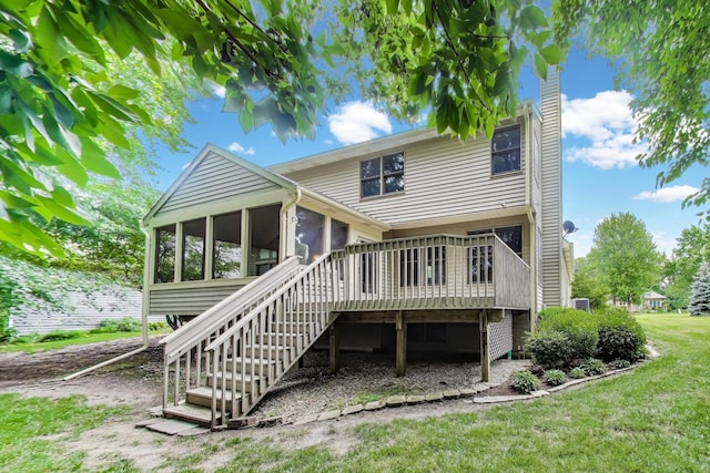 705 Wood Creek Dr, Antioch, IL 60002 - back of property with a sunroom, stairs, a yard, a chimney, and a deck