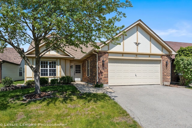20936 Orange Blossom Ln, Plainfield, IL 60544 - view of front facade featuring brick siding, asphalt driveway, a garage, a front lawn, and a shingled roof