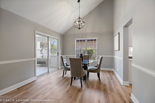 20936 Orange Blossom Ln, Plainfield, IL 60544 - dining area with a chandelier, high vaulted ceiling, and light wood-style flooring
