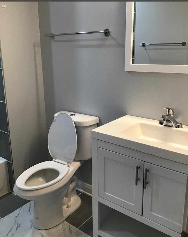 4629 S Langley Ave, Chicago, IL 60653 - bathroom featuring vanity, marble look tile flooring, a bathtub, and a shower
