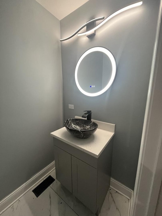 4629 S Langley Ave, Chicago, IL 60653 - bathroom with marble look tiles and vanity