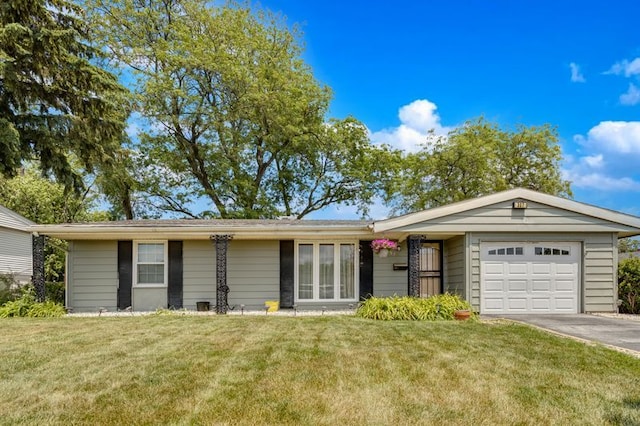 337 E Clark St, Glenwood, IL 60425 - single story home with a garage, driveway, and a front lawn