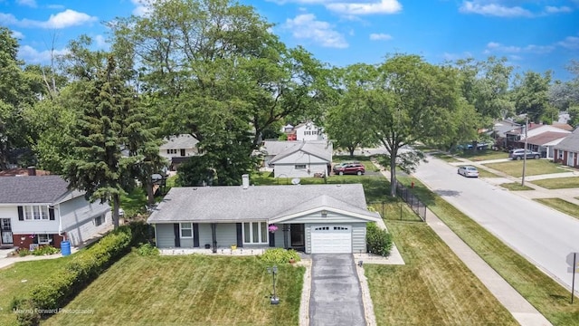 337 E Clark St, Glenwood, IL 60425 - view of front of home featuring a garage, a residential view, driveway, and a front yard