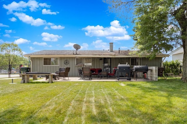 337 E Clark St, Glenwood, IL 60425 - rear view of property featuring a patio area, board and batten siding, and a chimney