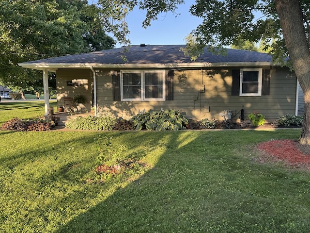 1202 E Van Buren St, Clinton, IL 61727 - view of front of home featuring a front yard and a shingled roof