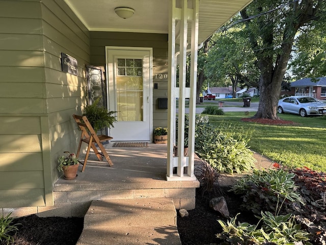1202 E Van Buren St, Clinton, IL 61727 - view of exterior entry with a porch