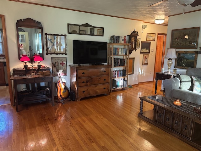 1202 E Van Buren St, Clinton, IL 61727 - living room featuring crown molding, wood finished floors, and a ceiling fan