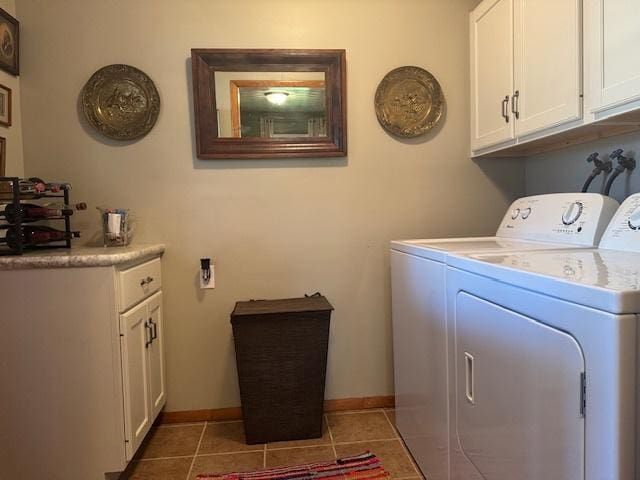 1202 E Van Buren St, Clinton, IL 61727 - laundry room with independent washer and dryer, cabinet space, and light tile patterned floors