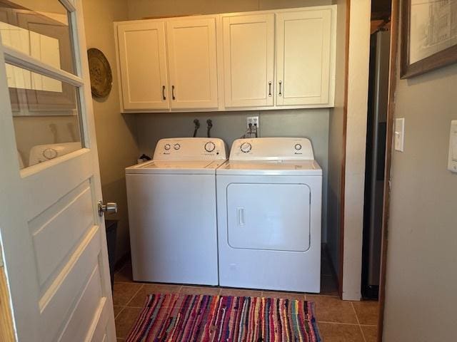 1202 E Van Buren St, Clinton, IL 61727 - laundry area featuring cabinet space, washer and clothes dryer, and tile patterned floors