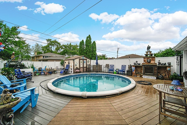 5848 W 89th St, Oak Lawn, IL 60453 - view of swimming pool featuring a wooden deck, a fenced backyard, and a shed