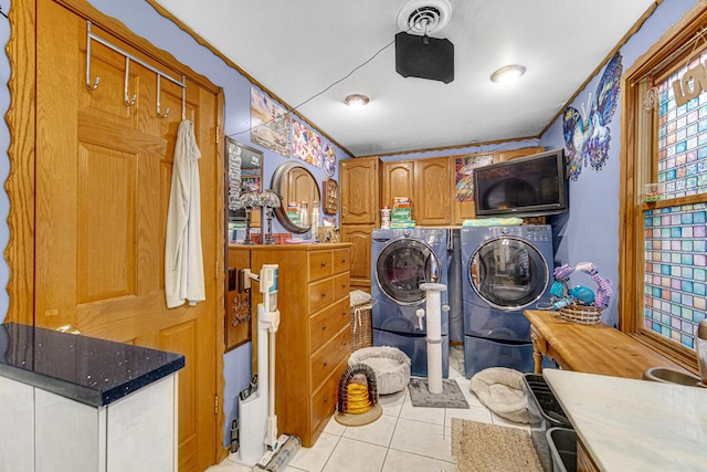 5848 W 89th St, Oak Lawn, IL 60453 - laundry room featuring separate washer and dryer, light tile patterned floors, cabinet space, and crown molding