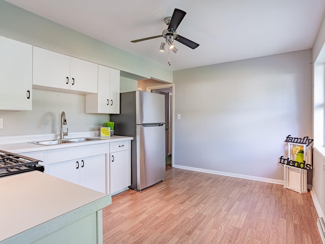 57 Forest Ln, Elk Grove Village, IL 60007 - kitchen featuring freestanding refrigerator, light wood-style floors, and light countertops