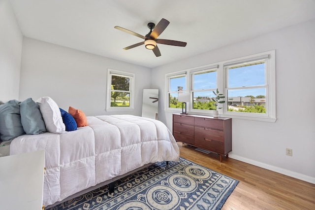 1110 N Main St, Normal, IL 61761 - bedroom with wood finished floors and a ceiling fan