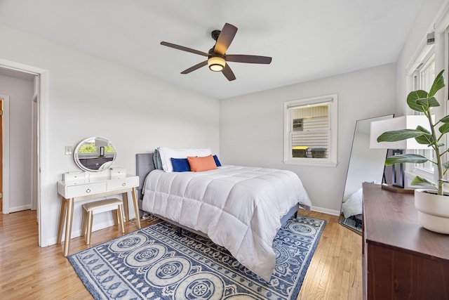 1110 N Main St, Normal, IL 61761 - bedroom featuring light wood finished floors and a ceiling fan