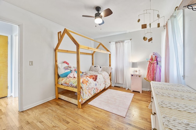 1110 N Main St, Normal, IL 61761 - bedroom featuring light wood finished floors and ceiling fan