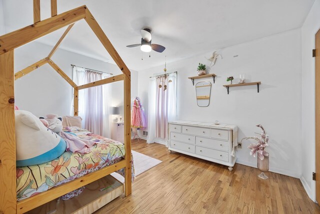 1110 N Main St, Normal, IL 61761 - bedroom with multiple windows, wood finished floors, and ceiling fan