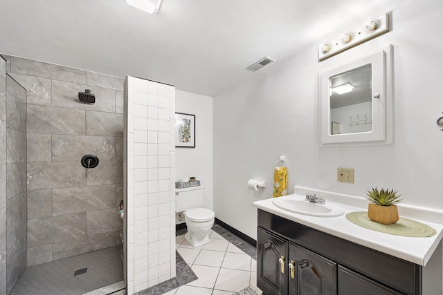 1110 N Main St, Normal, IL 61761 - bathroom with vanity, a tile shower, and tile patterned flooring