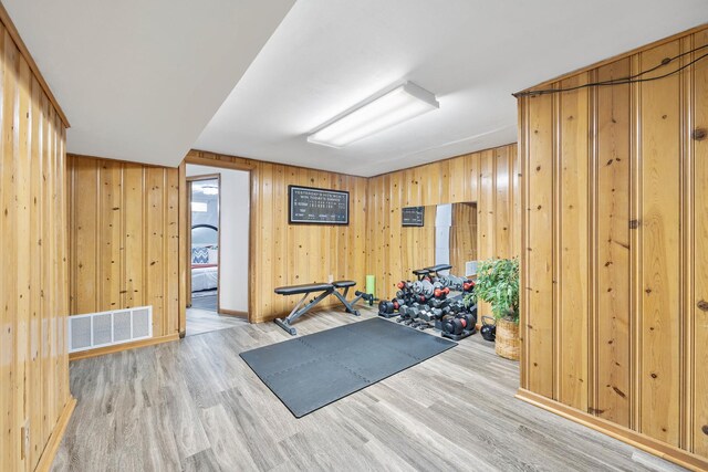 1110 N Main St, Normal, IL 61761 - exercise area featuring wood finished floors and wooden walls