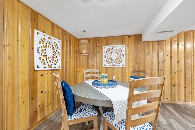 1110 N Main St, Normal, IL 61761 - dining area with wood finished floors and wooden walls