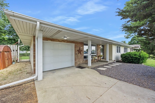 1110 N Main St, Normal, IL 61761 - view of front of property featuring concrete driveway, an attached garage, and brick siding