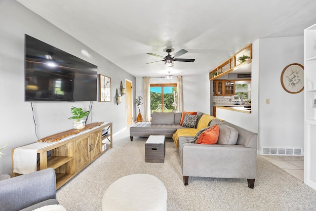 1110 N Main St, Normal, IL 61761 - carpeted living area with ceiling fan and baseboards