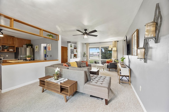 1110 N Main St, Normal, IL 61761 - living room with a ceiling fan and light carpet