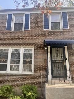 1329 E 89th Pl, Chicago, IL 60619 - view of front facade featuring brick siding