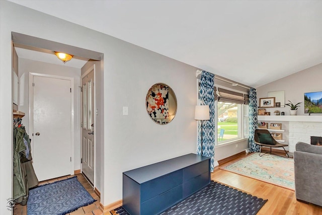4839 Lamb Dr, Oak Lawn, IL 60453 - entryway featuring wood finished floors, a fireplace, and vaulted ceiling