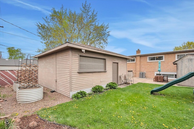4839 Lamb Dr, Oak Lawn, IL 60453 - back of property with an outdoor structure, a patio, and a playground