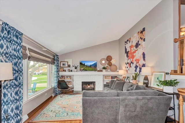 4839 Lamb Dr, Oak Lawn, IL 60453 - living room featuring wood finished floors, vaulted ceiling, and a fireplace