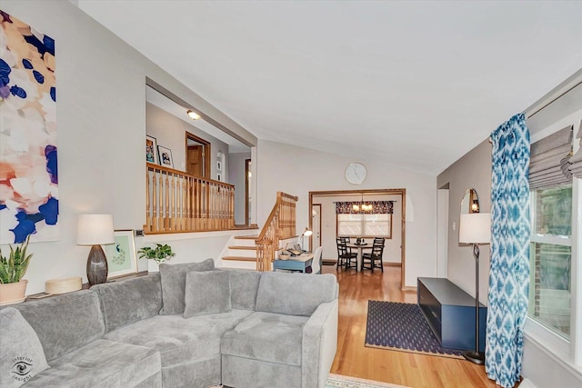 4839 Lamb Dr, Oak Lawn, IL 60453 - living area featuring stairway, wood finished floors, vaulted ceiling, and a chandelier