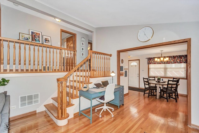 4839 Lamb Dr, Oak Lawn, IL 60453 - stairway featuring a chandelier and wood finished floors