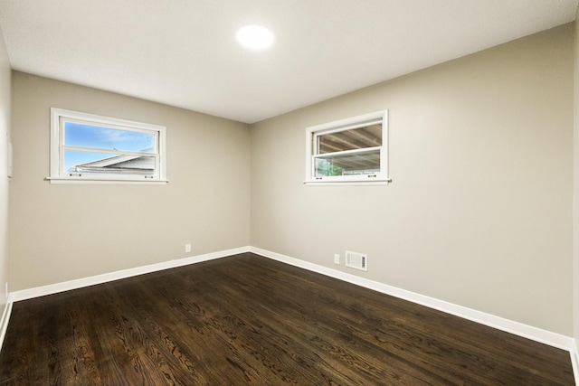 4506 W 77th Pl, Chicago, IL 60652 - empty room with plenty of natural light and dark wood-style flooring